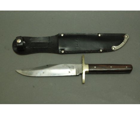 W Wilkinson & Son Sheffield Bowie knife, brass coloured crossguard, hardwood scales and sheath.  Blade 6".
