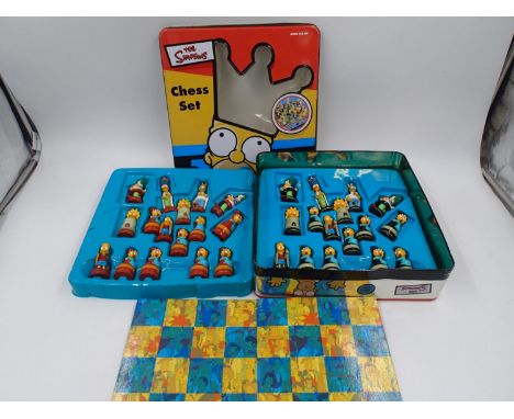 Official The Simpsons chess set in tin case, complete and excellent condition, some cracks to thin plastic trays as pictured.