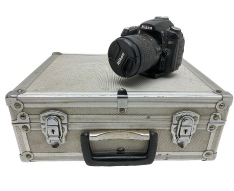 Collection of photography equipment - Nikon D90 DSLR camera, Nikon DX SWM VR lens, various flashes, umbrella light box, vario