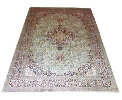 PURE SILK VERY FINE KASHAN DESIGN CARPET, 280cm x 190cm, central midnight blue medallion surrounded by a celadon field and ma