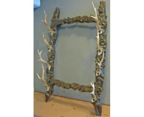 GUN/STICK RACK, Black Forest, with carved wooden frame and deer horn rifle/walking stick rests, 55cm W x 94cm H overall.