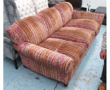 GEORGE SMITH SOFA, three seater, with patterned polychrome upholstery on short turned front supports with castors, 227cm L. 