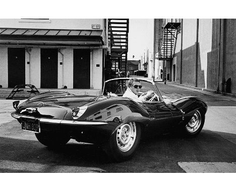 'STEVE MCQUEEN IN HIS JAGUAR XK-SS', print, 45cm x 67cm, framed. 