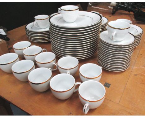 DINNER SERVICE, 16 place settings white and gold, comprising dinner plates, side plates, shallow bowls and cups and saucers. 