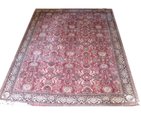 TABRIZ CARPET, 338cm x 280cm, scrolling vines, flowering branches and flowerhead palmettes on a cerise field within correspon