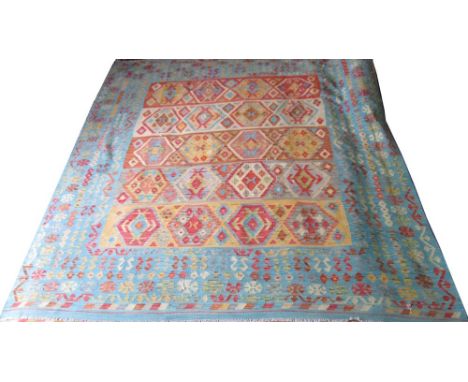 PERSIAN KILIM CARPET, 296cm x 258cm, of multiple diamond medallions in polychrome shades with azure border. 