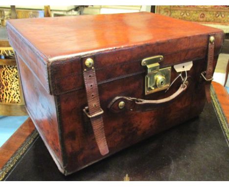 TOP HAT CASE, early 20th century brown leather with brass fittings and fitted interior, 'Army and navy store' label with JC i