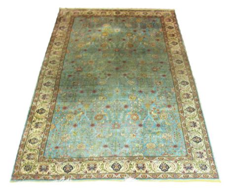 PURE SILK QUM RUG, 159cm x 250cm, allover palmettes and vines with birds on a jade border within a palmette border. (with wea