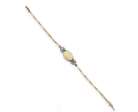 An Early Twentieth Century Opal and Diamond Bracelet, an oval opal in a claw setting and spaced by grain set old cut diamond 