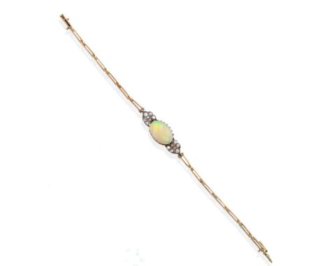 An Early Twentieth Century Opal and Diamond Bracelet, an oval opal in a claw setting and spaced by grain set old cut diamond 