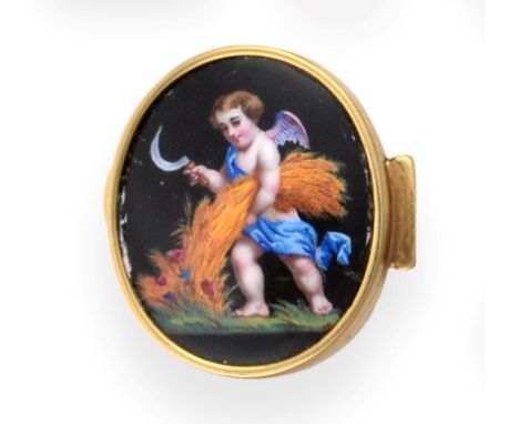 A Gold and Enamel Pill Box, stamped 15ct, probably circa 1900, oval with reeded sides, the hinged cover decorated with a wing