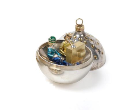 Stuart Devlin: A Parcel Gilt Silver Surprise Christmas Bauble, London 1985, the interior with a pair of figures watching a te