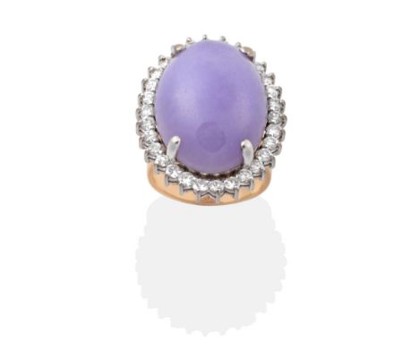 A Lavender Jade and Diamond Cluster Ring, an oval lavender jade within a border of round brilliant cut diamonds, to a taperin