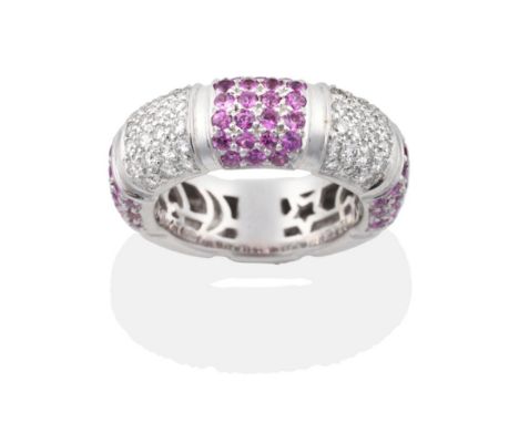 A Pink Sapphire and Diamond Hoop Ring, bands of alternating pavé  set round cut pink sapphires and round brilliant cut diamon