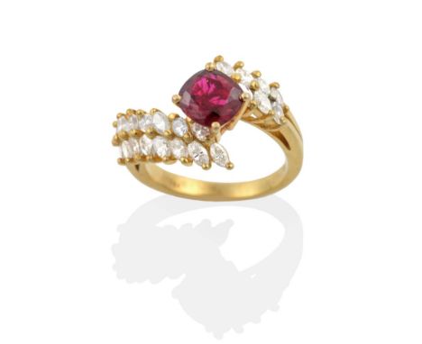 A Ruby and Diamond Ring, a cushion cut ruby in a claw setting, to marquise cut diamond set bypass shoulders, total estimated 