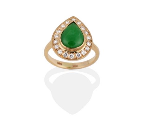 A Jade and Diamond Cluster Ring, a pear cut jade within a border of round brilliant cut diamonds, to tapering shoulders, tota