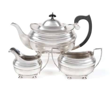 A Silver Three Piece Tea Service, S Blanckensee &amp; Son, Birmingham and London 1927, rounded rectangular, of George III sty