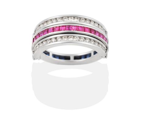 A Sapphire, Ruby and Diamond Flip Ring, half bands of channel set calibré cut rubies and sapphires spaced by hinged bands of 