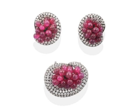 A Titanium Plated Ruby and Diamond Pendant and Earring Suite, as clusters of ruby beads within pavé set diamond scroll frames