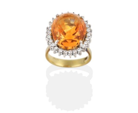 A Citrine and Diamond Cluster Ring, a round mixed cut citrine within a border of round brilliant cut diamonds, to knife edge 