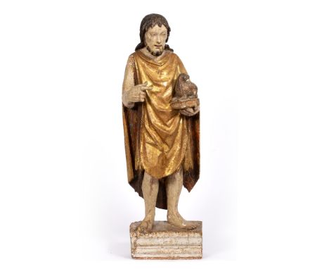 AN ANTIQUE POLYCHROME CARVED WOODEN FIGURE OF ST JOHN BAPTIST, depicting holding a book surmounted by a lamb in his left hand