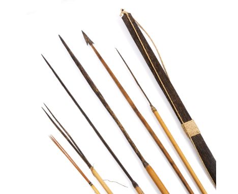 A TRIBAL BOW AND FISHING ARROWS, longest arrow 143cm 