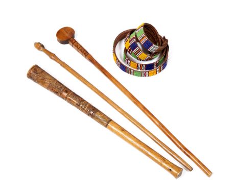 THREE WEST AFRICAN CEREMONIAL DANCE CLUBS, carved light wood with incised crosshatch decoration  longest 70cm with two south 