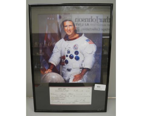 A signed cheque display signed by James B. Irwin, 8th person to walk on the moon 