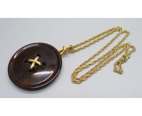 A large Crown Trifari button pendant and chain 