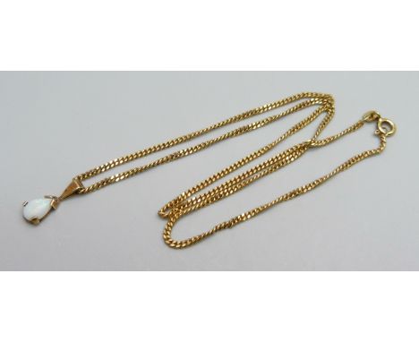 A yellow metal pendant set with an opal, on a 9ct gold chain, 4.3g, chain 39cm 