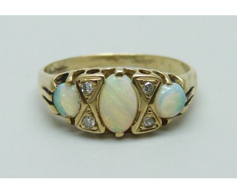 A 9ct gold opal and diamond ring, 1.8g, K 