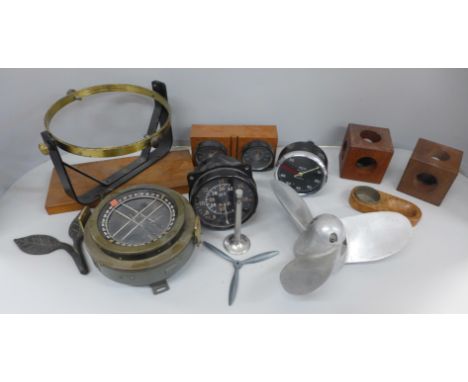 A Smiths RC83 rev counter, binnacle compass on stand, aircraft speedometer, Brannan weather station, boat propeller, etc. 