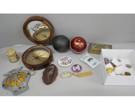 A cannonball, a Hurricane Indian cricket ball, badges, compass, etc. 