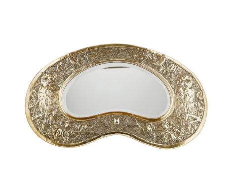 SCOTTISH SCHOOL  ARTS &amp; CRAFTS BRASS WALL MIRROR, CIRCA 1900   of kidney-shaped outline, the bevelled plate enclosed by f