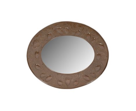 WILLIAM HENRY MAWSON FOR KESWICK HOME INDUSTRIES  ARTS &amp; CRAFTS COPPER WALL MIRROR, CIRCA 1900   of oval outline, repouss
