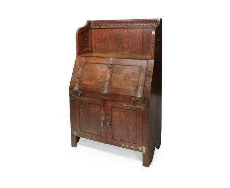 CHARLES EASTLAKE (1836-1906)  OAK GOTHIC REVIVAL BUREAU CABINET, CIRCA 1860   the upstand with open shelf, carved with foliat