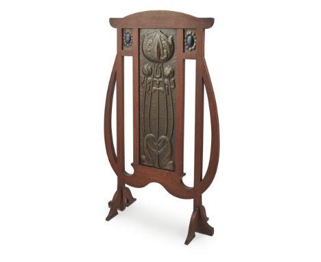 SHAPLAND &amp; PETTER, BARNSTAPLE  ART NOUVEAU MAHOGANY AND COPPER FIRESCREEN, CIRCA 1900   of shaped outline with embossed c