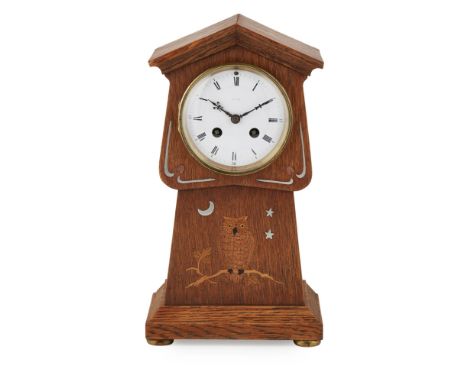ATTRIBUTED TO LIBERTY &amp; CO., LONDON  ARTS &amp; CRAFTS INLAID OAK MANTEL CLOCK, CIRCA 1900   the twin-train movement with