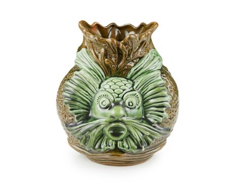 ATTRIBUTED TO CHRISTOPHER DRESSER FOR AULT POTTERY  CERAMIC VASE, 1880'S   each side modelled as a grotesque merman, glazed i