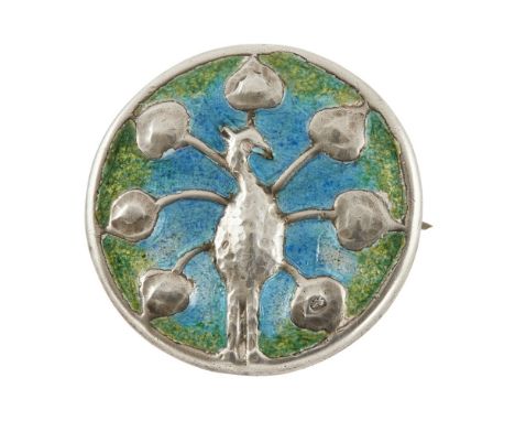 LIBERTY &amp; CO., LONDON  ARTS &amp; CRAFTS SILVER AND ENAMEL BROOCH, BIRMINGHAM 1901   decorated in relief with a peacock, 