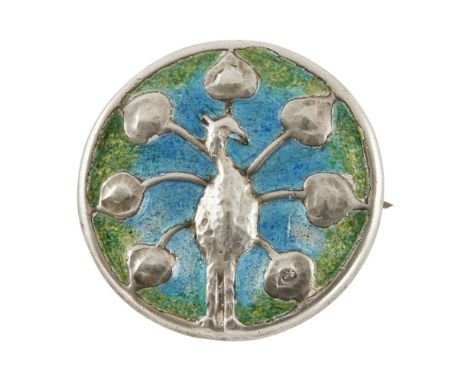 LIBERTY &amp; CO., LONDON  ARTS &amp; CRAFTS SILVER AND ENAMEL BROOCH, BIRMINGHAM 1901   decorated in relief with a peacock, 