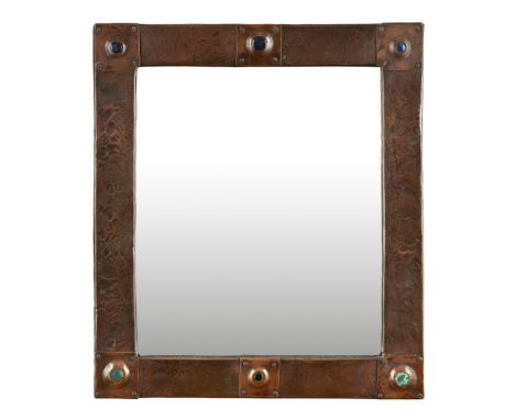 ENGLISH SCHOOL  ARTS &amp; CRAFTS COPPER WALL MIRROR, CIRCA 1900   the rectangular hammered frame set with Ruskin panels  35.