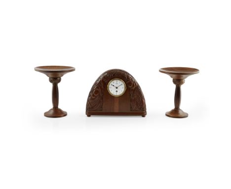 MANNER OF SUE ET MAR  ART DECO WALNUT OVERMANTEL GARNITURE, CIRCA 1930  each piece carved in low relief with stylised floweri