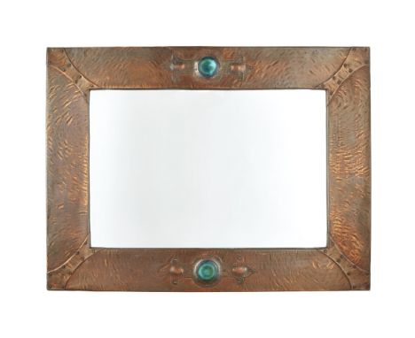 ARTS &amp; CRAFTS  ARTS &amp; CRAFTS PATINATED COPPER WALL MIRROR, CIRCA 1900   of rectangular outline, set with Ruskin round