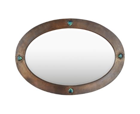LIBERTY &amp; CO., LONDON  ARTS &amp; CRAFTS PATINATED COPPER WALL MIRROR, CIRCA 1900   of oval outline, set with heart-shape