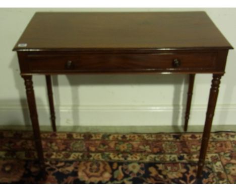 A Georgian mahogany side table with a single drawer on ring turned legs - Height 75 cm x Width 86 cm x Depth 46 cm