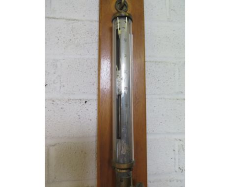 A brass Marine stick barometer and thermometer on a wooden mount - Height 1.07 m 