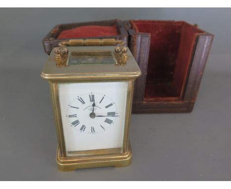 A 19th century brass cased carriage clock with white enamel dial, Roman numerals bearing Goldsmiths and Silversmiths Co. 112 