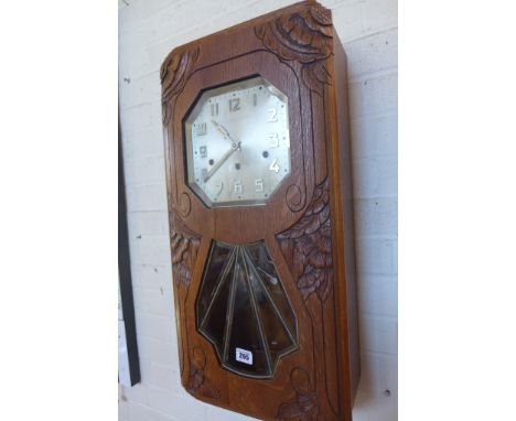 An Art Deco oak three train mantel clock with Westminster chime