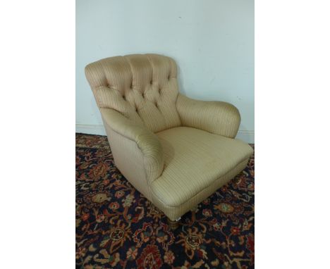 A Victorian Howard style button back deep seated arm chair numbered to back leg 1240/847